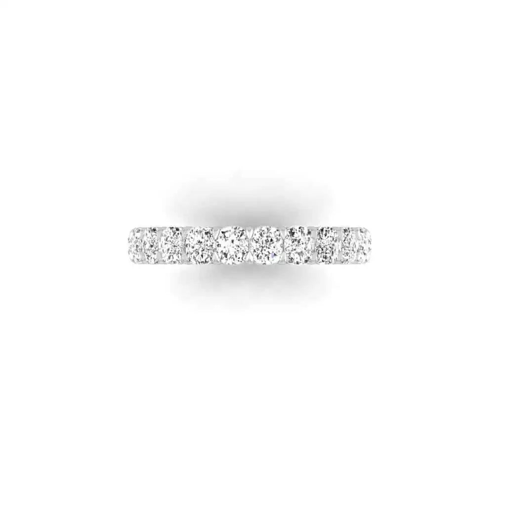 A close-up of the Full Diamond Eternity Ring, featuring small, sparkling diamonds encircling the entire 18KT gold band, set against a plain white background.