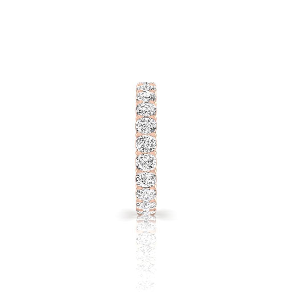 The Full Lab Grown Diamond Eternity Ring from Janet Heller Fine Jewelry, crafted in 18KT gold, features evenly spaced diamonds offered in various shapes and custom carat weights. The color of the diamonds is F and the clarity is VS. This is the perfect wedding band to be worn alone or stacked with your engagement ring.