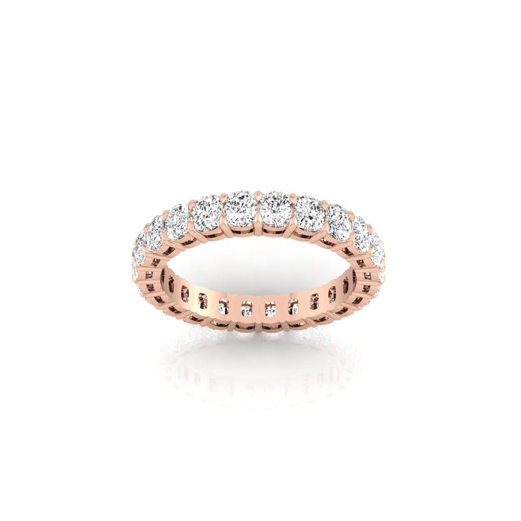 The Full Lab Grown Diamond Eternity Ring from Janet Heller Fine Jewelry, crafted in 18KT gold, features evenly spaced diamonds offered in various shapes and custom carat weights. The color of the diamonds is F and the clarity is VS. This is the perfect wedding band to be worn alone or stacked with your engagement ring.