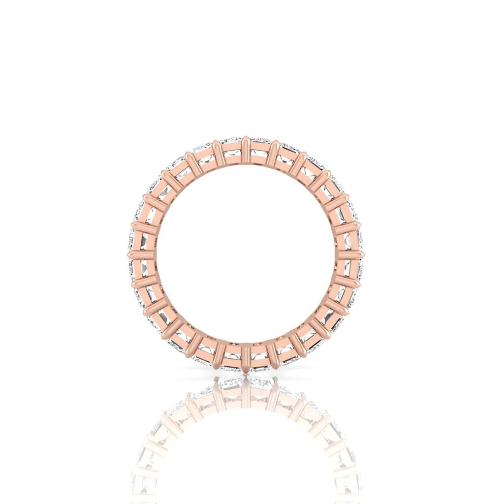 The Full Lab Grown Diamond Eternity Ring from Janet Heller Fine Jewelry, crafted in 18KT gold, features evenly spaced diamonds offered in various shapes and custom carat weights. The color of the diamonds is F and the clarity is VS. This is the perfect wedding band to be worn alone or stacked with your engagement ring.