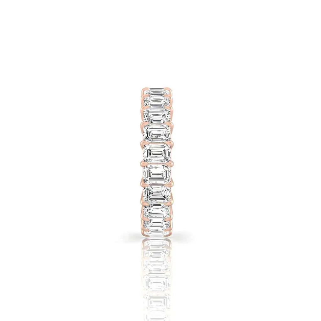 The Full Diamond Eternity Ring from Janet Heller Fine Jewelry is an 18KT gold eternity band with a continuous row of natural diamonds, offered in various shapes and carat weights. The color of the diamonds is F and the clarity is VS. This is the perfect wedding band to be worn alone or stacked with your engagement ring.