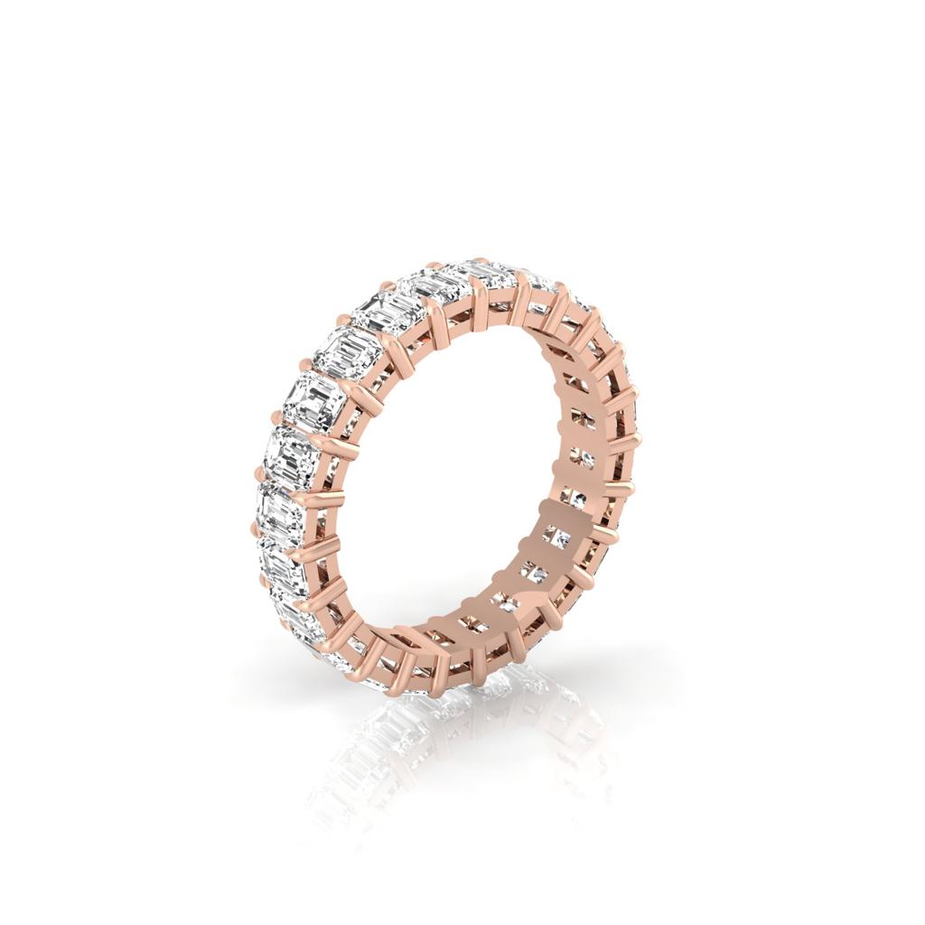 The Full Lab Grown Diamond Eternity Ring from Janet Heller Fine Jewelry, crafted in 18KT gold, features evenly spaced diamonds offered in various shapes and custom carat weights. The color of the diamonds is F and the clarity is VS. This is the perfect wedding band to be worn alone or stacked with your engagement ring.