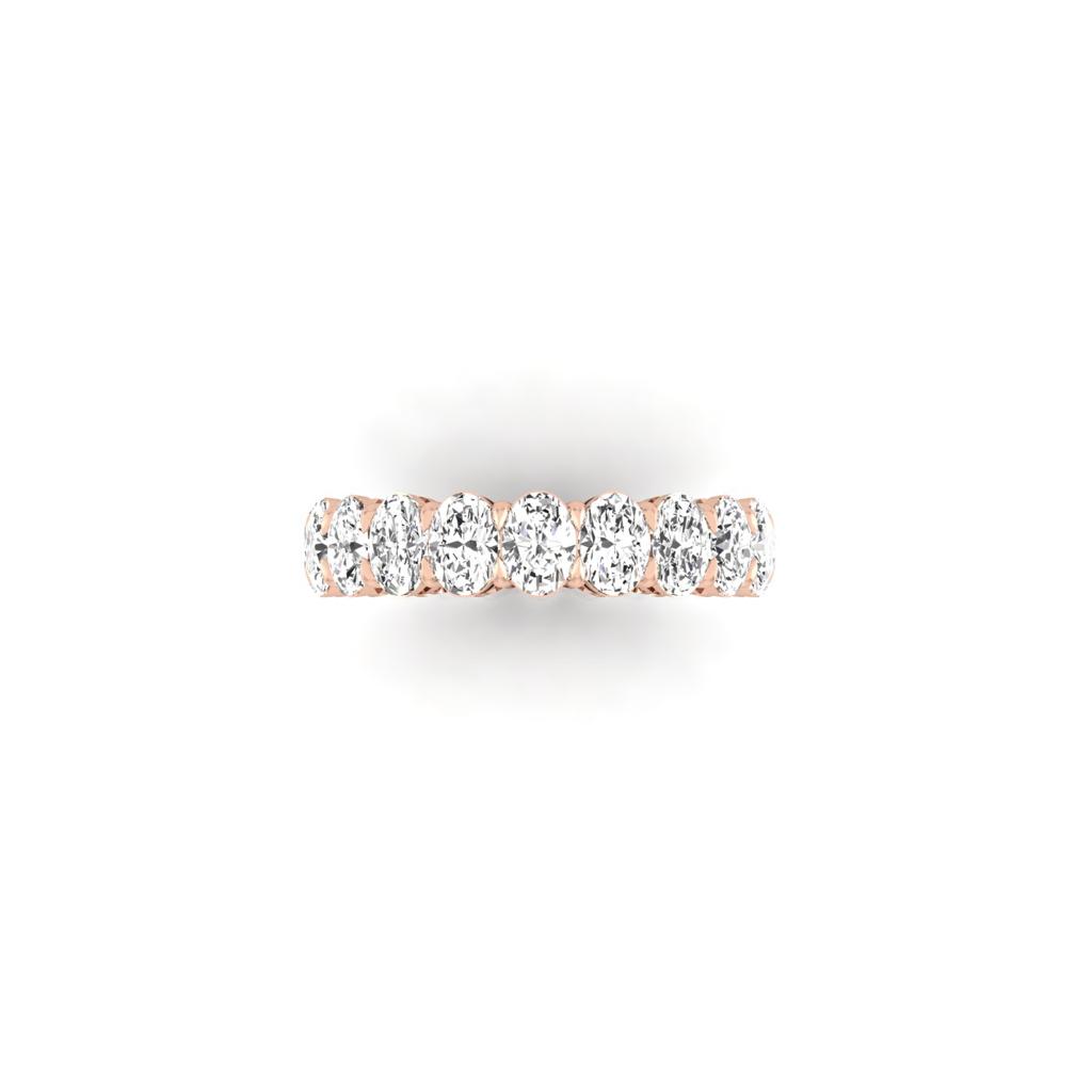 The Full Lab Grown Diamond Eternity Ring from Janet Heller Fine Jewelry, crafted in 18KT gold, features evenly spaced diamonds offered in various shapes and custom carat weights. The color of the diamonds is F and the clarity is VS. This is the perfect wedding band to be worn alone or stacked with your engagement ring.