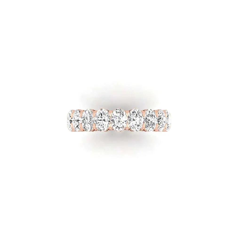 The Full Diamond Eternity Ring from Janet Heller Fine Jewelry, crafted in 18KT gold, features evenly spaced diamonds offered in various shapes and custom carat weights. The color of the diamonds is F and the clarity is VS. This is the perfect wedding band to be worn alone or stacked with your engagement ring.