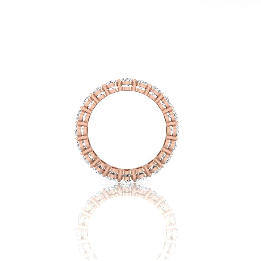 The Full Lab Grown Diamond Eternity Ring from Janet Heller Fine Jewelry, crafted in 18KT gold, features evenly spaced diamonds offered in various shapes and custom carat weights. The color of the diamonds is F and the clarity is VS. This is the perfect wedding band to be worn alone or stacked with your engagement ring.