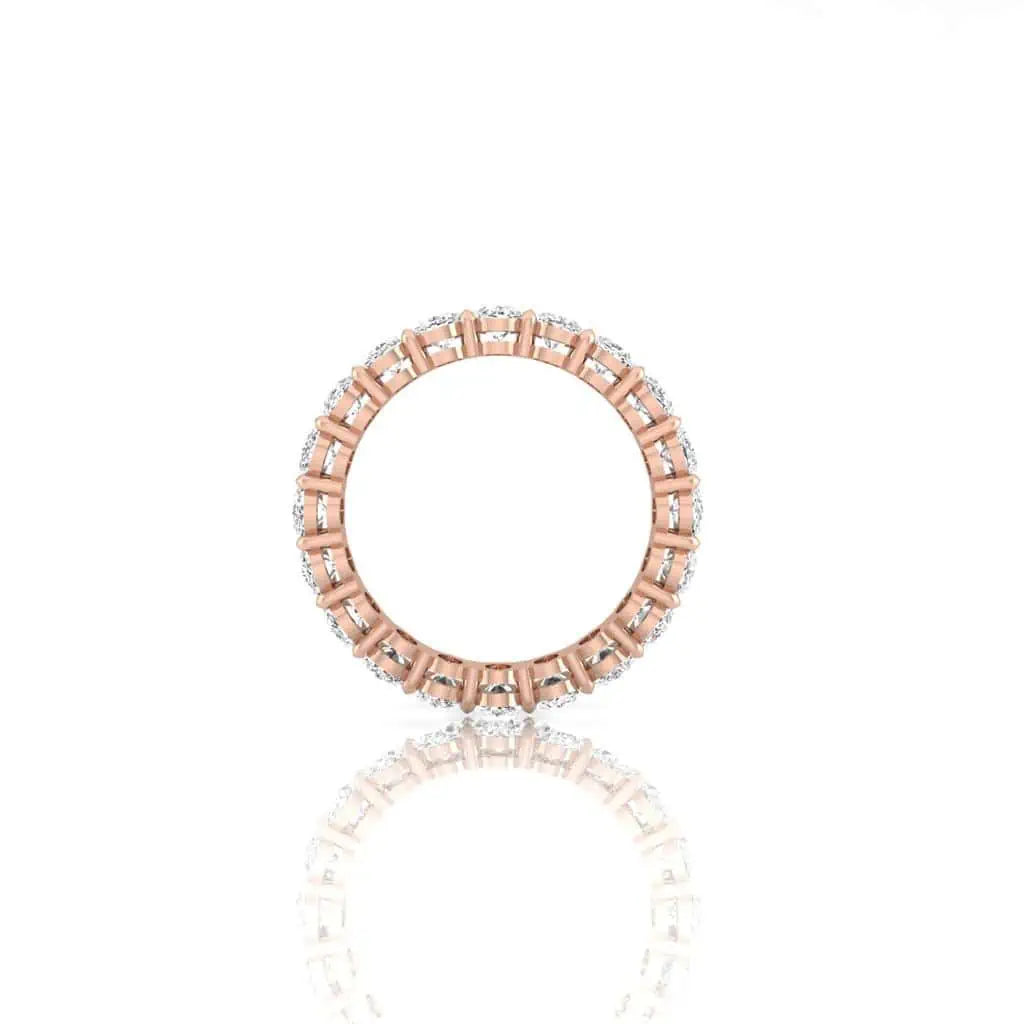 The Full Diamond Eternity Ring from Janet Heller Fine Jewelry, crafted in 18KT gold, features evenly spaced diamonds offered in various shapes and custom carat weights. The color of the diamonds is F and the clarity is VS. This is the perfect wedding band to be worn alone or stacked with your engagement ring.