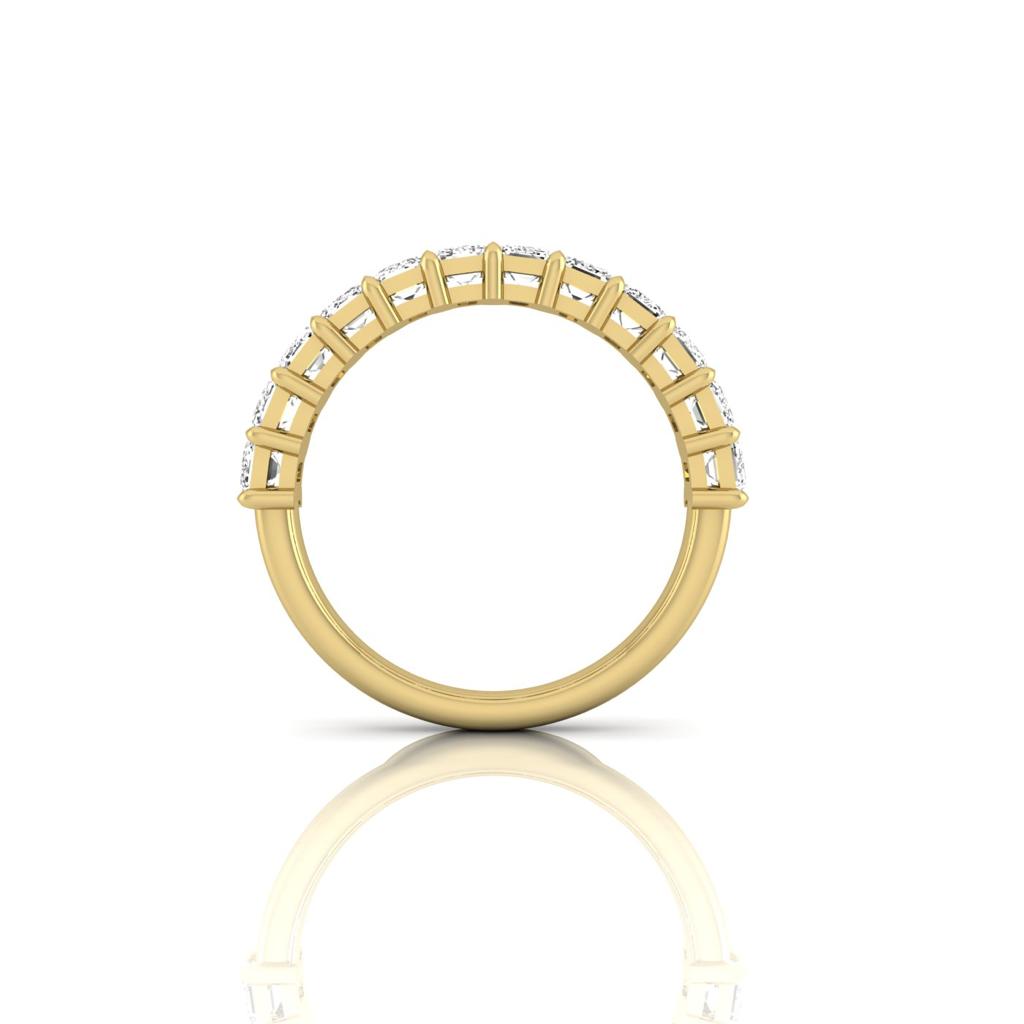 The Half Lab Grown Diamond Eternity Ring from Janet Heller Fine Jewelry, crafted in 18KT gold, features a row of evenly spaced diamonds offered in various shapes and custom carat weights. The color of the diamonds is F and the clarity is VS. This is the perfect wedding band to be worn alone or stacked with your engagement ring.