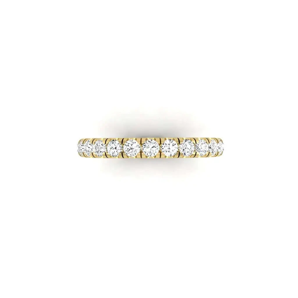 The 1ct Round Diamond Eternity Ring is an exquisite piece crafted from 18KT gold with small, circular VS clarity diamonds set closely around the band, beautifully displayed against a plain white background.