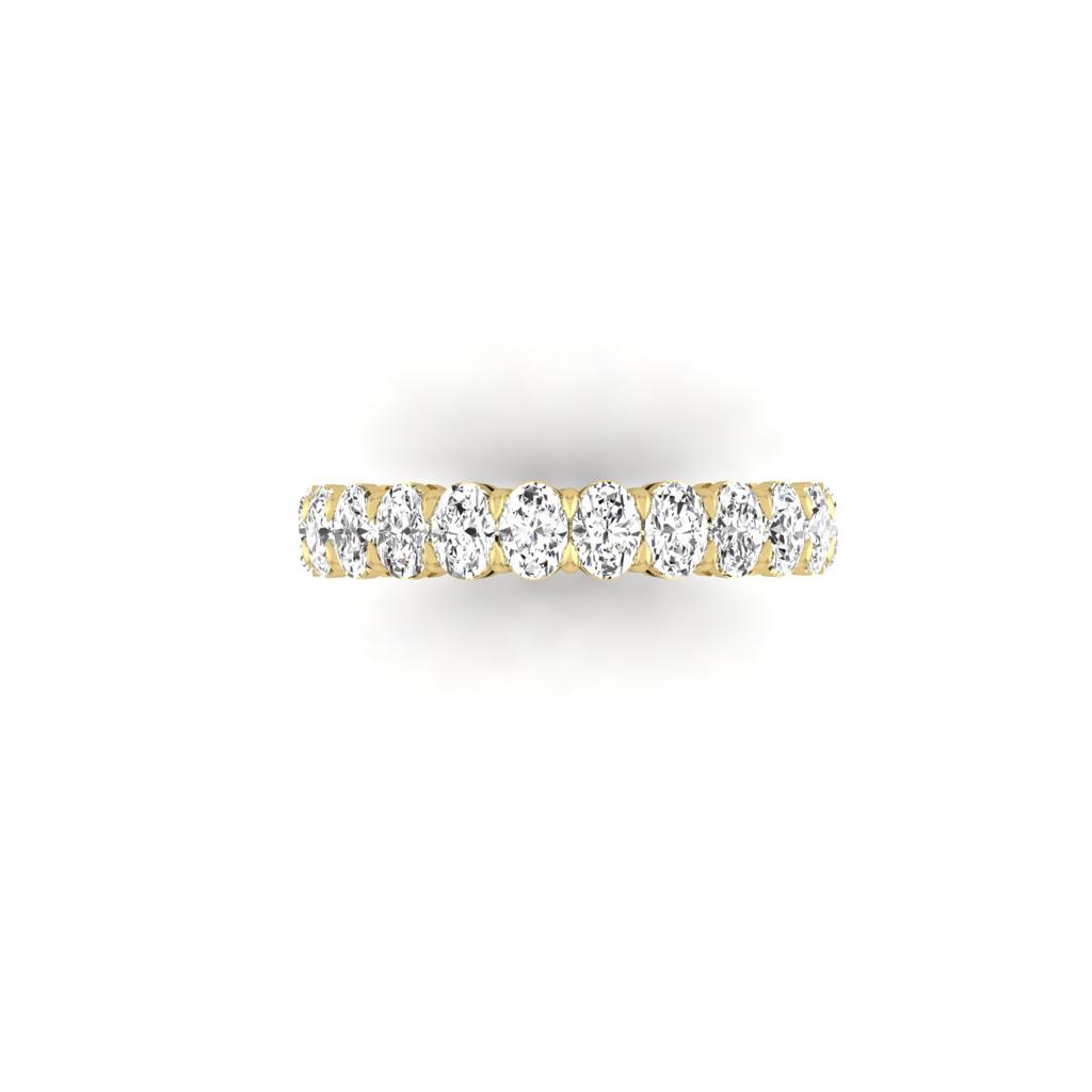The Full Lab Grown Diamond Eternity Ring from Janet Heller Fine Jewelry, crafted in 18KT gold, features evenly spaced diamonds offered in various shapes and custom carat weights. The color of the diamonds is F and the clarity is VS. This is the perfect wedding band to be worn alone or stacked with your engagement ring.