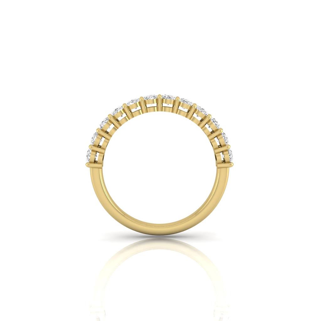 The Half Lab Grown Diamond Eternity Ring is created from 18KT gold, showcasing a row of round white lab-grown diamonds set along its top half. It is beautifully presented on a reflective white surface.