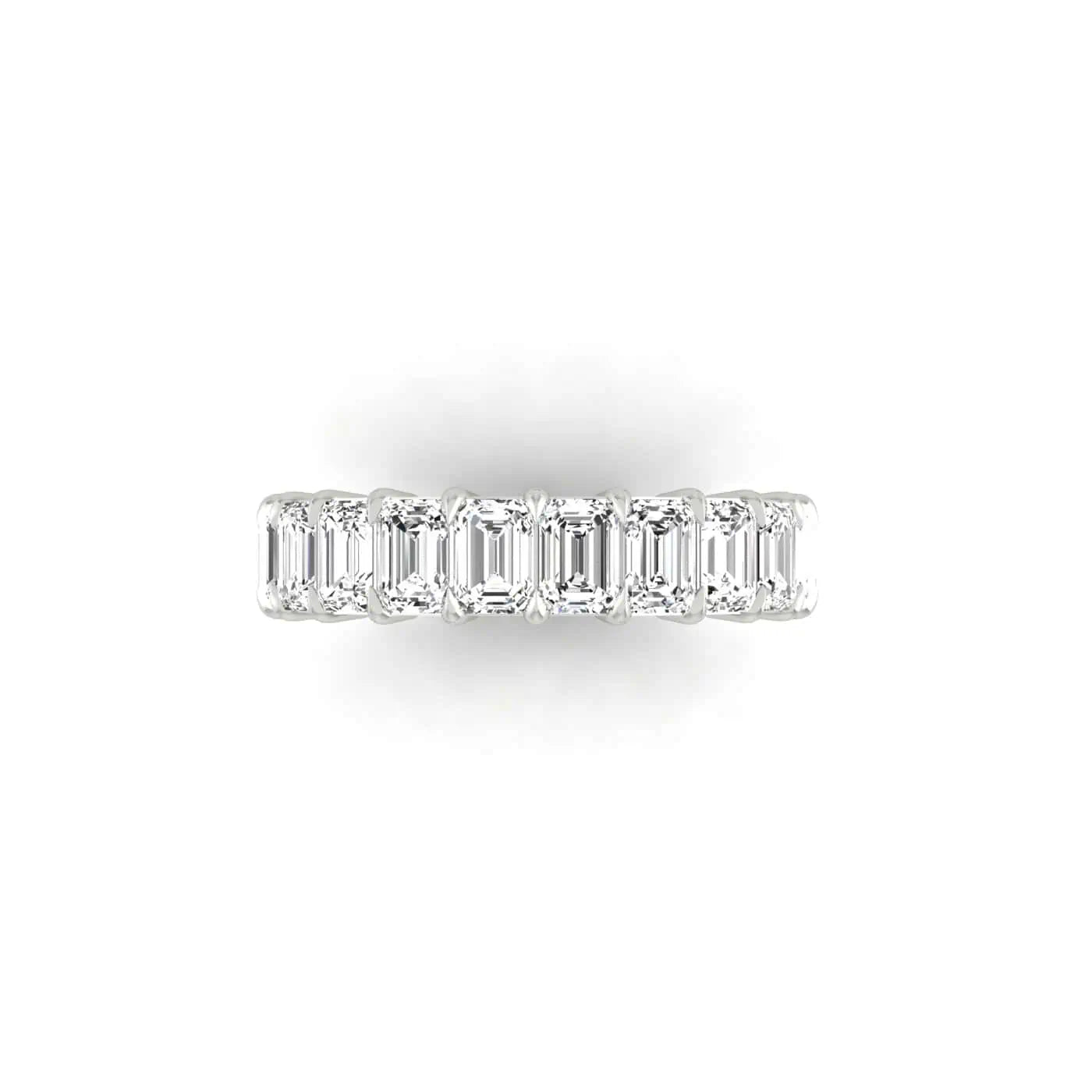 The Full Lab Grown Diamond Eternity Ring from Janet Heller Fine Jewelry, crafted in 18KT gold, features evenly spaced diamonds offered in various shapes and custom carat weights. The color of the diamonds is F and the clarity is VS. This is the perfect wedding band to be worn alone or stacked with your engagement ring.