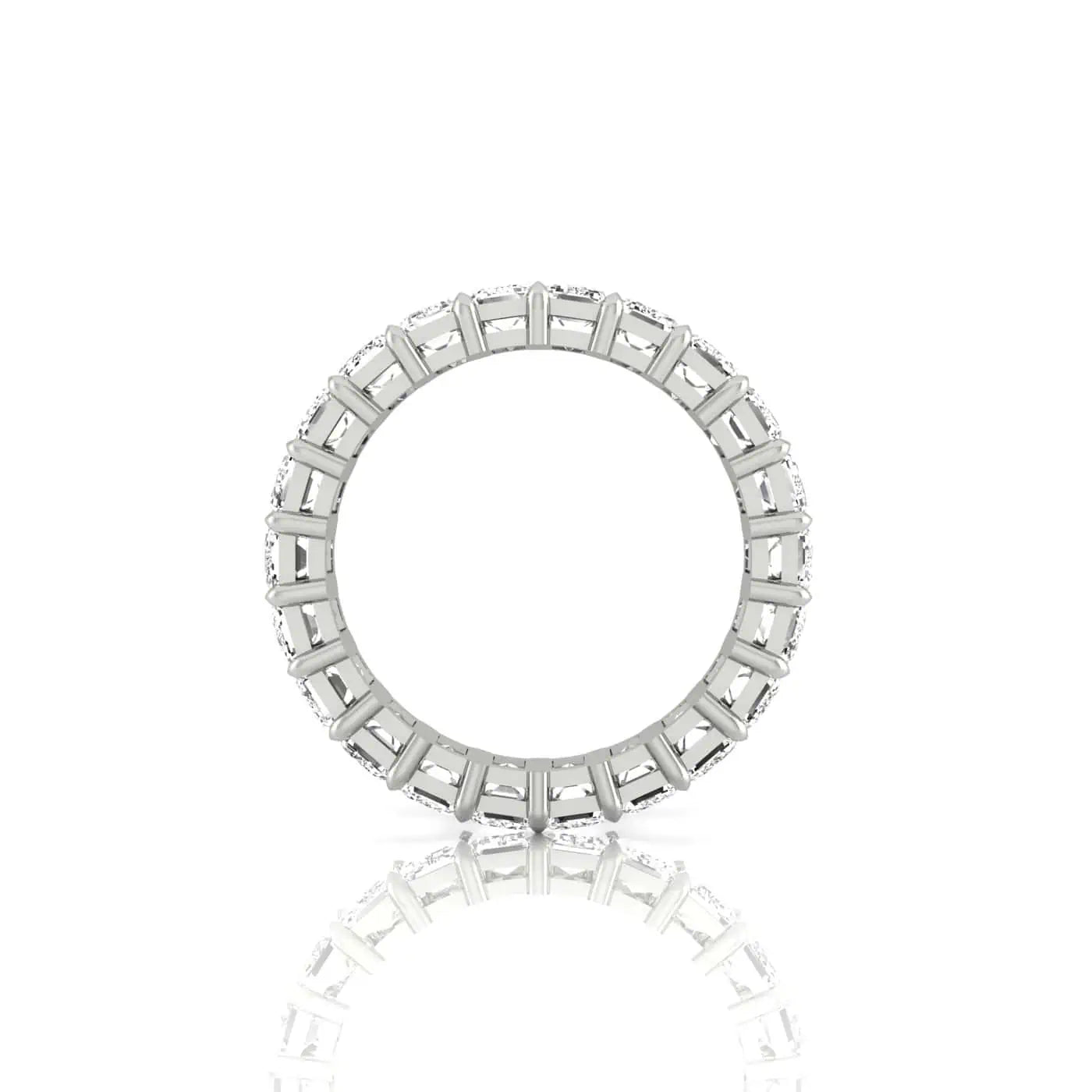 The Full Diamond Eternity Ring features a silver band with circular designs, highlighted by 18KT gold rectangular accents around its edge. The minimalist piece is showcased on a white background, creating a gentle reflection below.