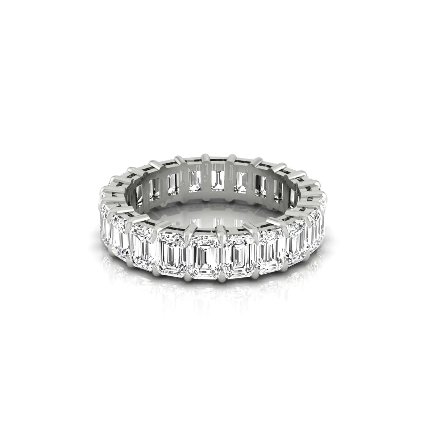 The Full Lab Grown Diamond Eternity Ring from Janet Heller Fine Jewelry, crafted in 18KT gold, features evenly spaced diamonds offered in various shapes and custom carat weights. The color of the diamonds is F and the clarity is VS. This is the perfect wedding band to be worn alone or stacked with your engagement ring.