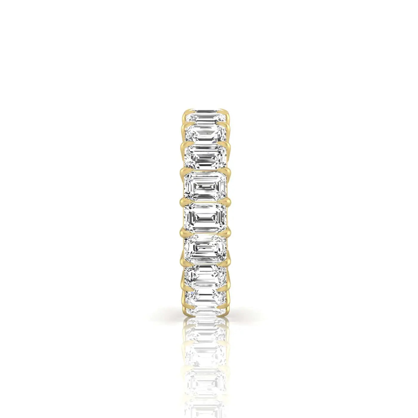 The Full Diamond Eternity Ring from Janet Heller Fine Jewelry, crafted in 18KT gold, features evenly spaced diamonds offered in various shapes and custom carat weights. The color of the diamonds is F and the clarity is VS. This is the perfect wedding band to be worn alone or stacked with your engagement ring.