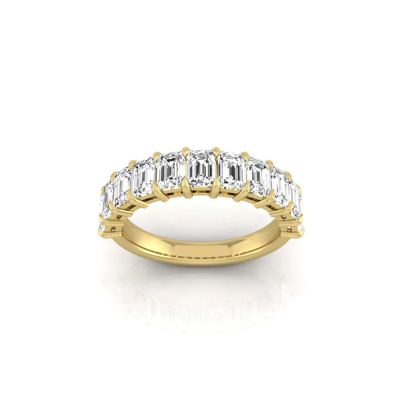 The Half Diamond Eternity Ring, crafted in 18KT gold, showcases emerald-cut diamonds with VS Clarity in a symmetrical row for simple elegance. Set against a plain white backdrop, it highlights exceptional sparkle and craftsmanship.