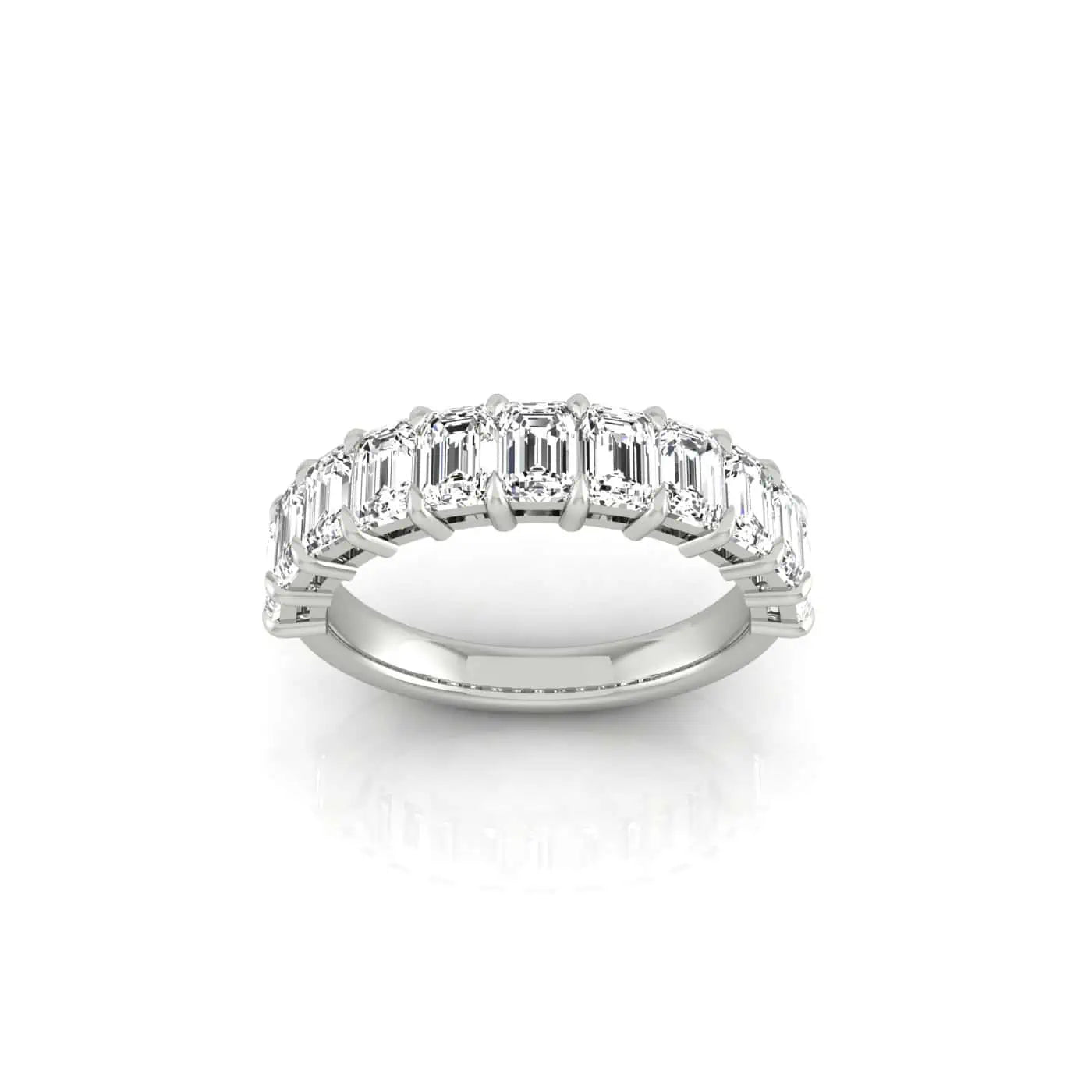 The Half Diamond Eternity Ring is silver with emerald-cut, clear gemstones of VS Clarity arranged along the band, shown on a white background.
