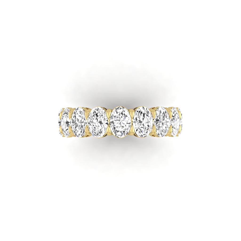 The Full Lab Grown Diamond Eternity Ring from Janet Heller Fine Jewelry, crafted in 18KT gold, features evenly spaced diamonds offered in various shapes and custom carat weights. The color of the diamonds is F and the clarity is VS. This is the perfect wedding band to be worn alone or stacked with your engagement ring.
