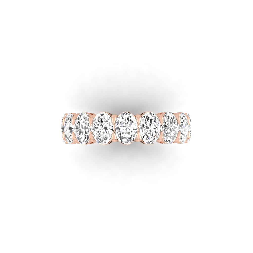 The Full Lab Grown Diamond Eternity Ring from Janet Heller Fine Jewelry, crafted in 18KT gold, features evenly spaced diamonds offered in various shapes and custom carat weights. The color of the diamonds is F and the clarity is VS. This is the perfect wedding band to be worn alone or stacked with your engagement ring.