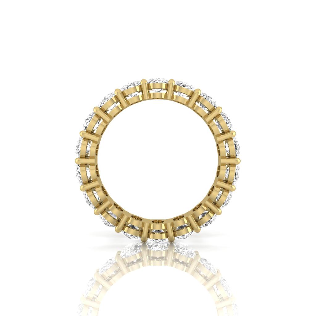 The Full Lab Grown Diamond Eternity Ring from Janet Heller Fine Jewelry, crafted in 18KT gold, features evenly spaced diamonds offered in various shapes and custom carat weights. The color of the diamonds is F and the clarity is VS. This is the perfect wedding band to be worn alone or stacked with your engagement ring.
