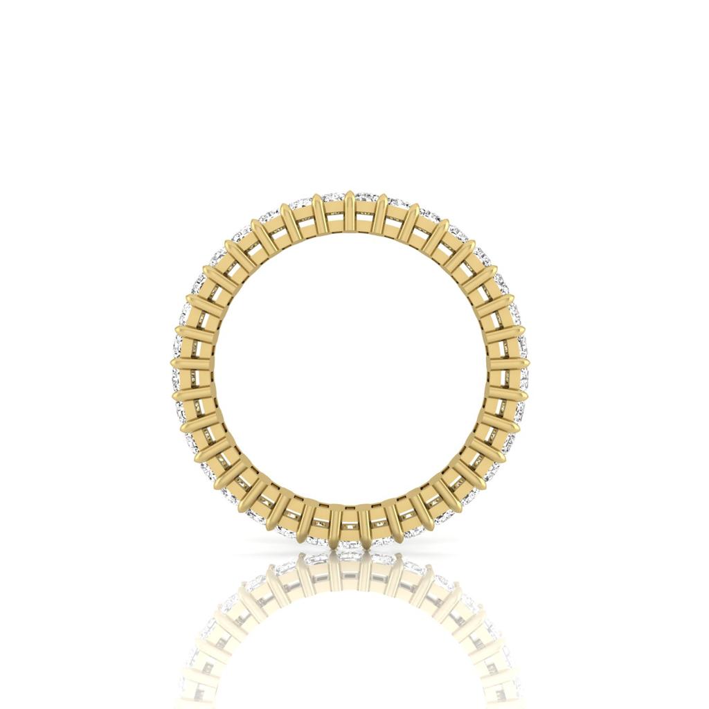 A gold hoop earring adorned with gemstones against a white backdrop showcases its exquisite design. Made from 18KT Gold, the reflective surface creates a subtle mirror effect, adding elegance to this beautiful piece. Product: Full Lab Grown Diamond Eternity Ring.
