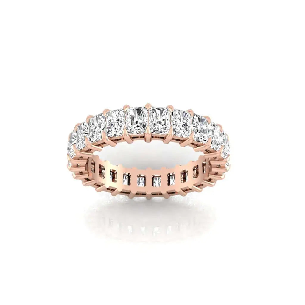 The Full Diamond Eternity Ring, crafted from 18KT rose gold, features a continuous row of emerald-cut clear gemstones with VS Clarity, showcasing exceptional brilliance. It is elegantly set against a plain white background.