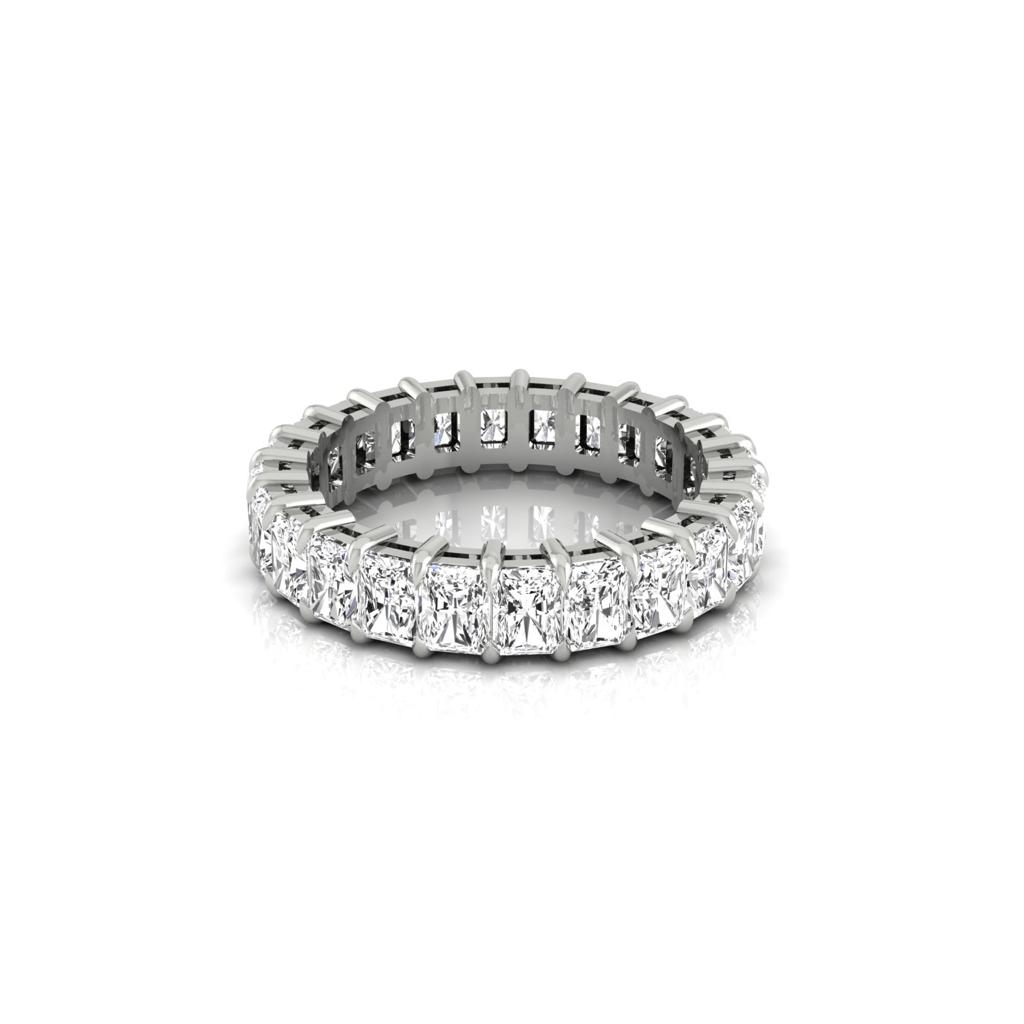 The Full Lab Grown Diamond Eternity Ring in 18KT gold showcases a seamless row of square-cut diamonds encircling the band, with F Color VS Clarity. Set against a plain white background, this piece highlights its intricate settings and dazzling gemstones.