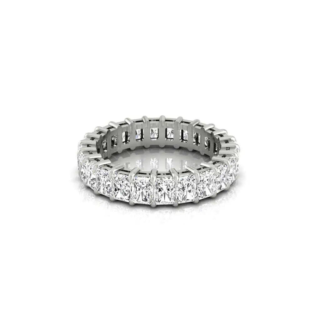 The Full Diamond Eternity Ring showcases a continuous row of sparkling diamonds with VS Clarity and F Color, set in a prong setting, elegantly encircling the silver band. Its displayed isolated on a plain white background.