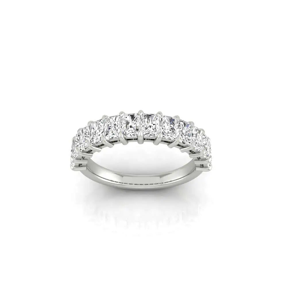 The Half Diamond Eternity Ring features a silver band with a continuous row of sparkling, oval-shaped VS Clarity diamonds, displayed against a crisp white background.