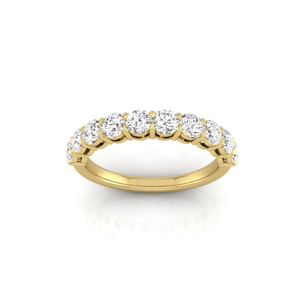The Half Lab Grown Diamond Eternity Ring from Janet Heller Fine Jewelry, crafted in 18KT gold, features a row of evenly spaced diamonds offered in various shapes and custom carat weights. The color of the diamonds is F and the clarity is VS. This is the perfect wedding band to be worn alone or stacked with your engagement ring.