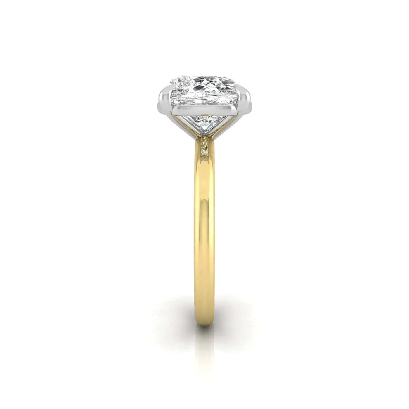 Side view of a Solitaire gold ring with an 18KT setting, showcasing a clear, round-cut diamond in a prong setting atop a slender, polished band against a white background.