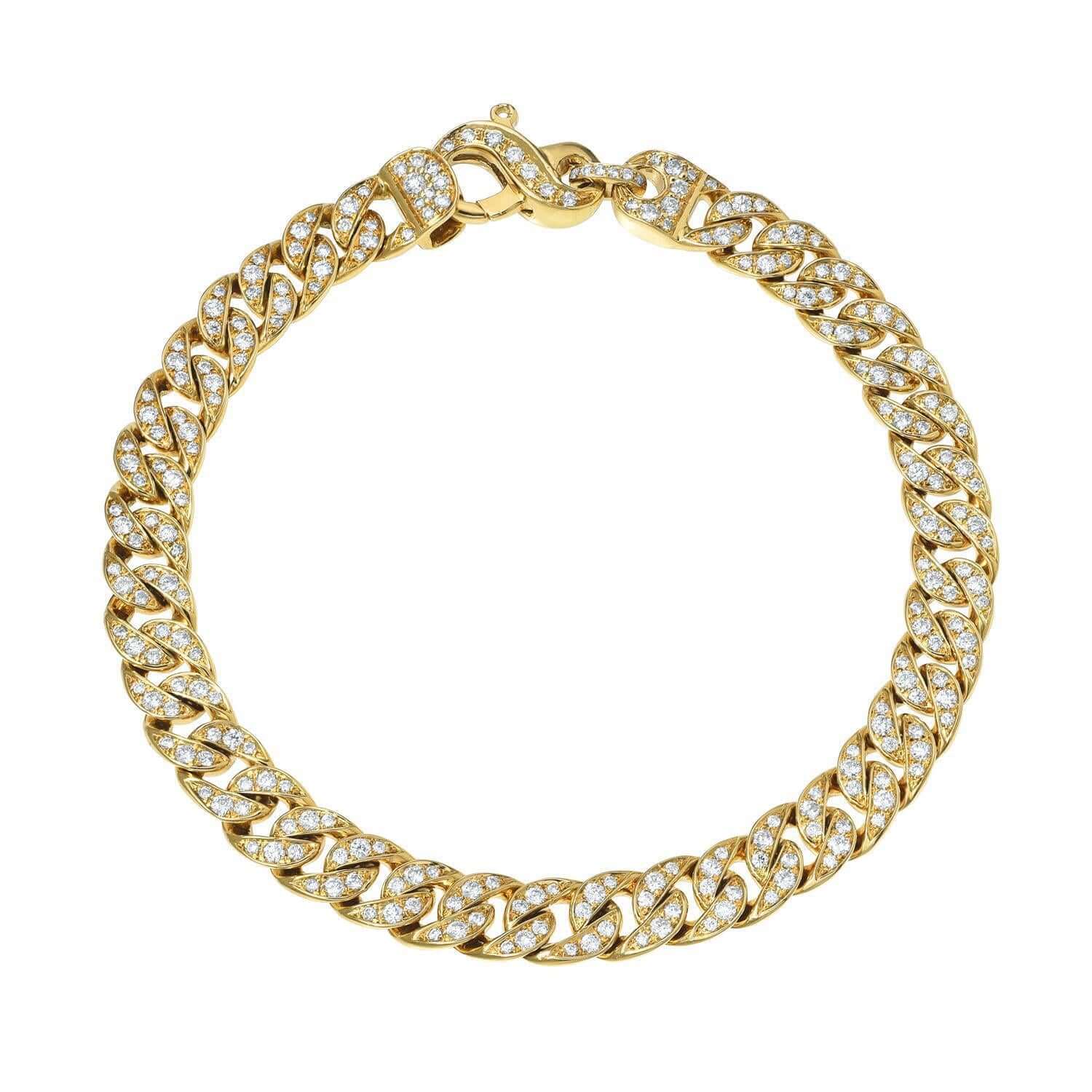 The Full Diamond Cuban Link Bracelet from Janet Heller Fine Jewelry is crafted in 14KT gold.  The bracelet features a link chain with diamonds, and an intricate interlocking diamond clasp closure.