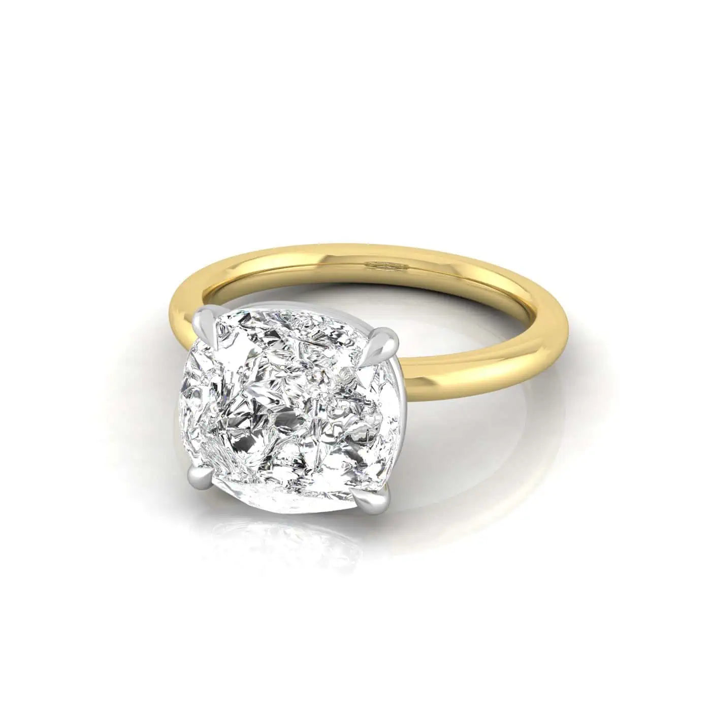 The Solitaire engagement ring, crafted from 18KT gold, showcases a mesmerizing cushion-cut diamond in a solitaire setting. Its intricate facets sparkle against a polished gold band on a white background, enhancing the rings elegance.