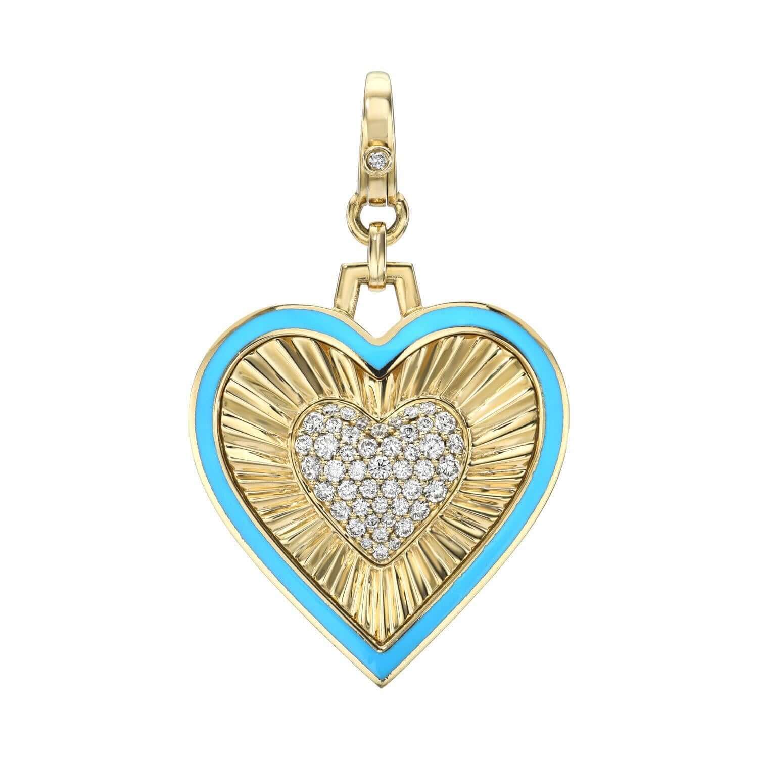 The Diamond Blue Enamel Heart Charm from Janet Heller Fine Jewelry is crafted in 14KT gold. The pendant is heart-shaped and features a diamond-encrusted center bordered by blue enamel. The diamond clasp clips easily onto various Janet Heller Fine Jewelry chains and necklaces.