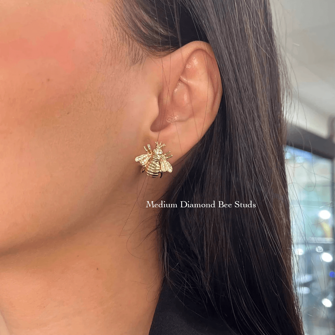 The Diamond Bee Studs from Janet Heller Fine Jewelry are crafted in 14KT gold. The studs feature gold bees adorned with diamonds. The earrings can be worn on their own or layered along the ear with other earrings.