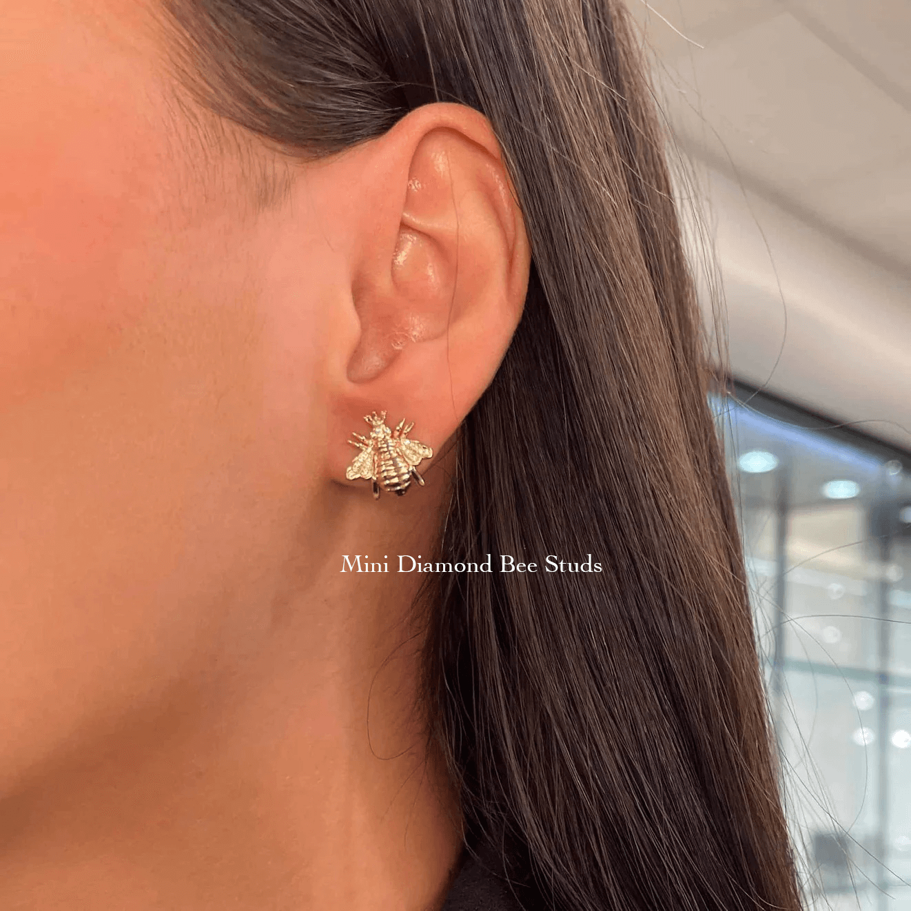 The Diamond Bee Studs from Janet Heller Fine Jewelry are crafted in 14KT gold. The studs feature gold bees adorned with diamonds. The earrings can be worn on their own or layered along the ear with other earrings.