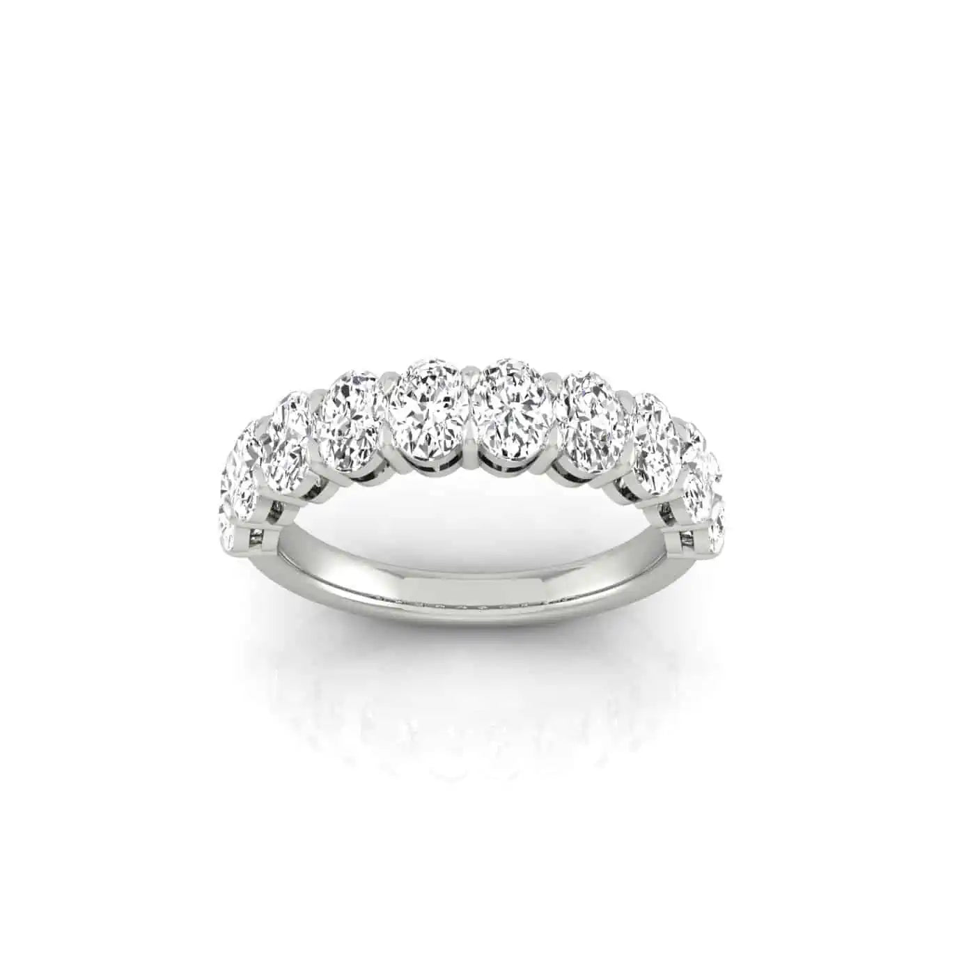 The Half Diamond Eternity Ring features a row of round, VS Clarity diamonds set in silver, sparkling continuously against a plain white background.