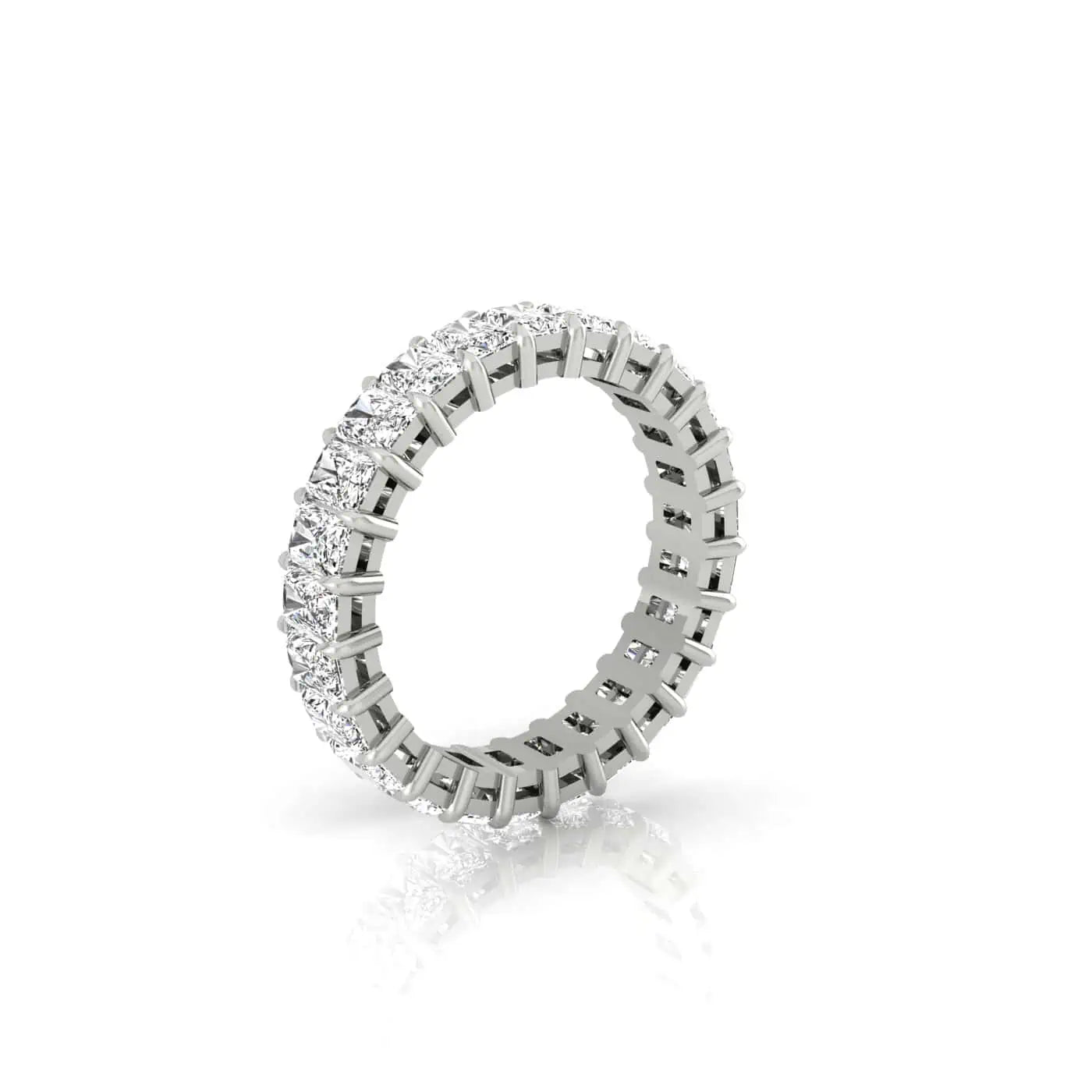 Displayed on a white background, the Full Diamond Eternity Ring, crafted from polished 18KT gold and adorned with VS clarity gemstones around its entire band, is slightly angled to showcase its reflective and intricate design.