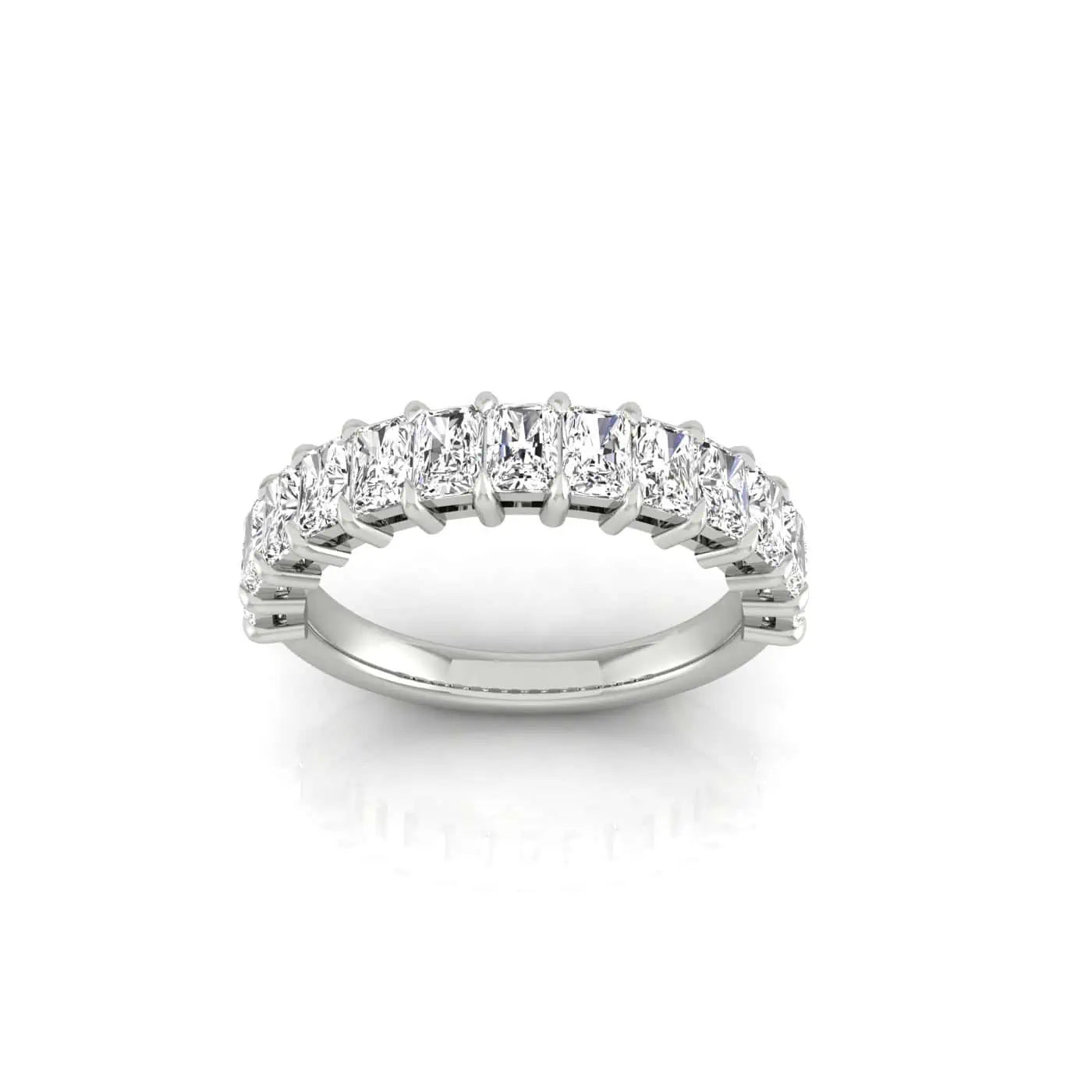 The Half Diamond Eternity Ring showcases a silver band with a row of rectangular-cut diamonds in a shared prong setting. Displayed on white, this elegant design captivates with its VS Clarity gems and refined beauty.