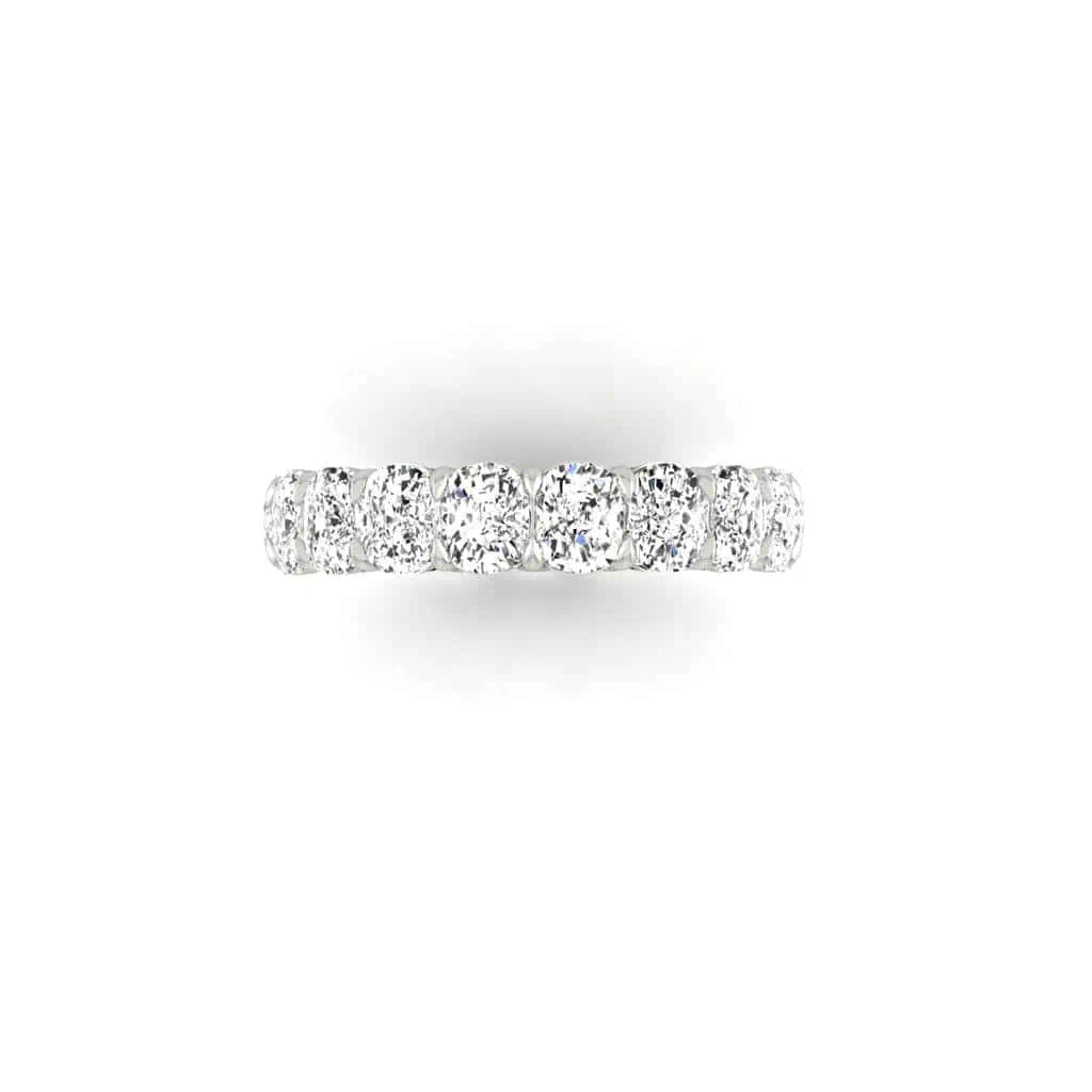 The Full Diamond Eternity Ring features a seamless silver band with a row of sparkling round diamonds, crafted in 18KT gold with VS Clarity and F Color. Its top view showcases the brilliance of each diamond for an elegant design.