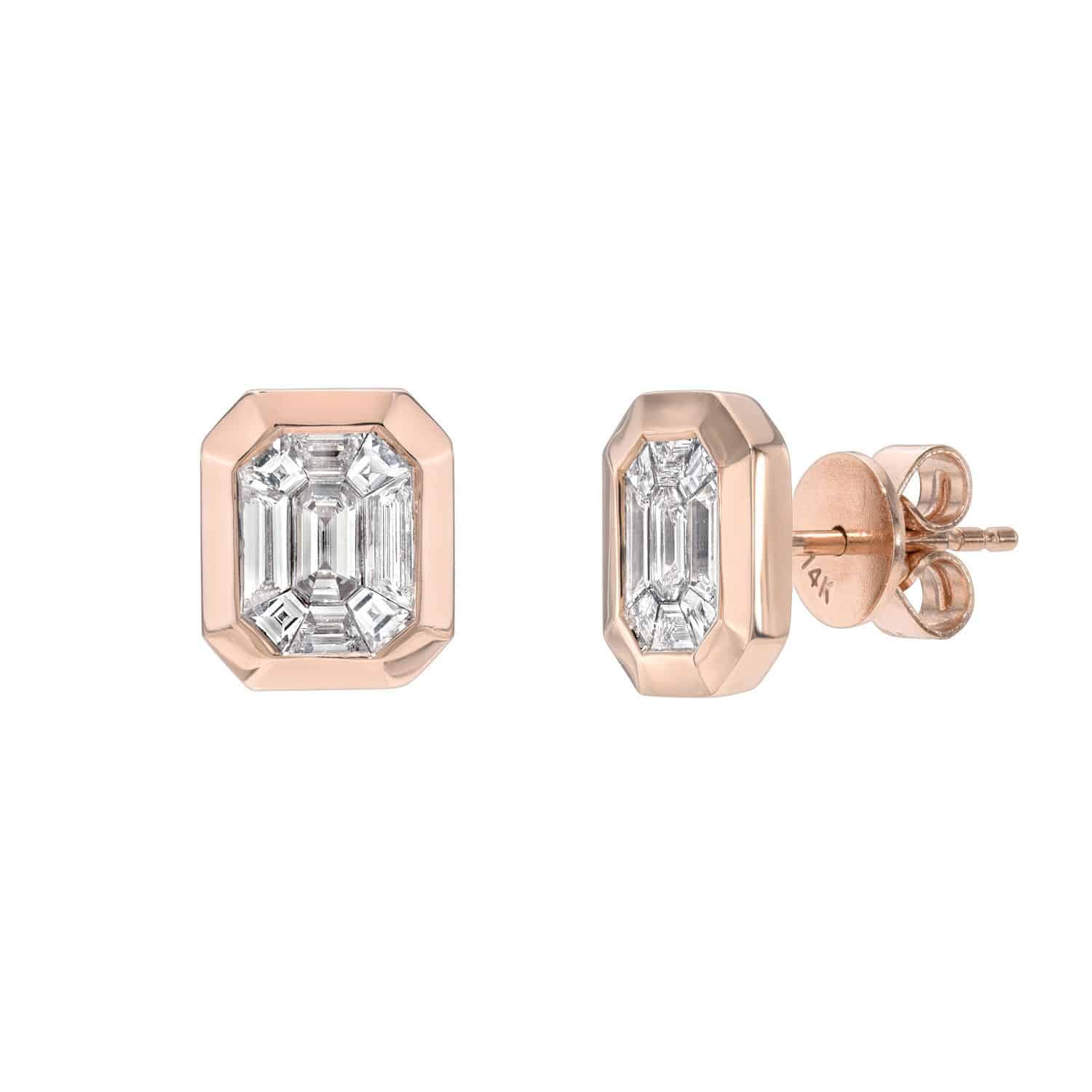 A pair of Bezel Baguette Diamond Studs in rose gold, each featuring an emerald-cut diamond set securely in a sleek bezel setting, shown from the front and side on a white background. For jewelry inquiries or to explore custom jewelry options, discover the elegance of Janet Heller Fine Jewelry.