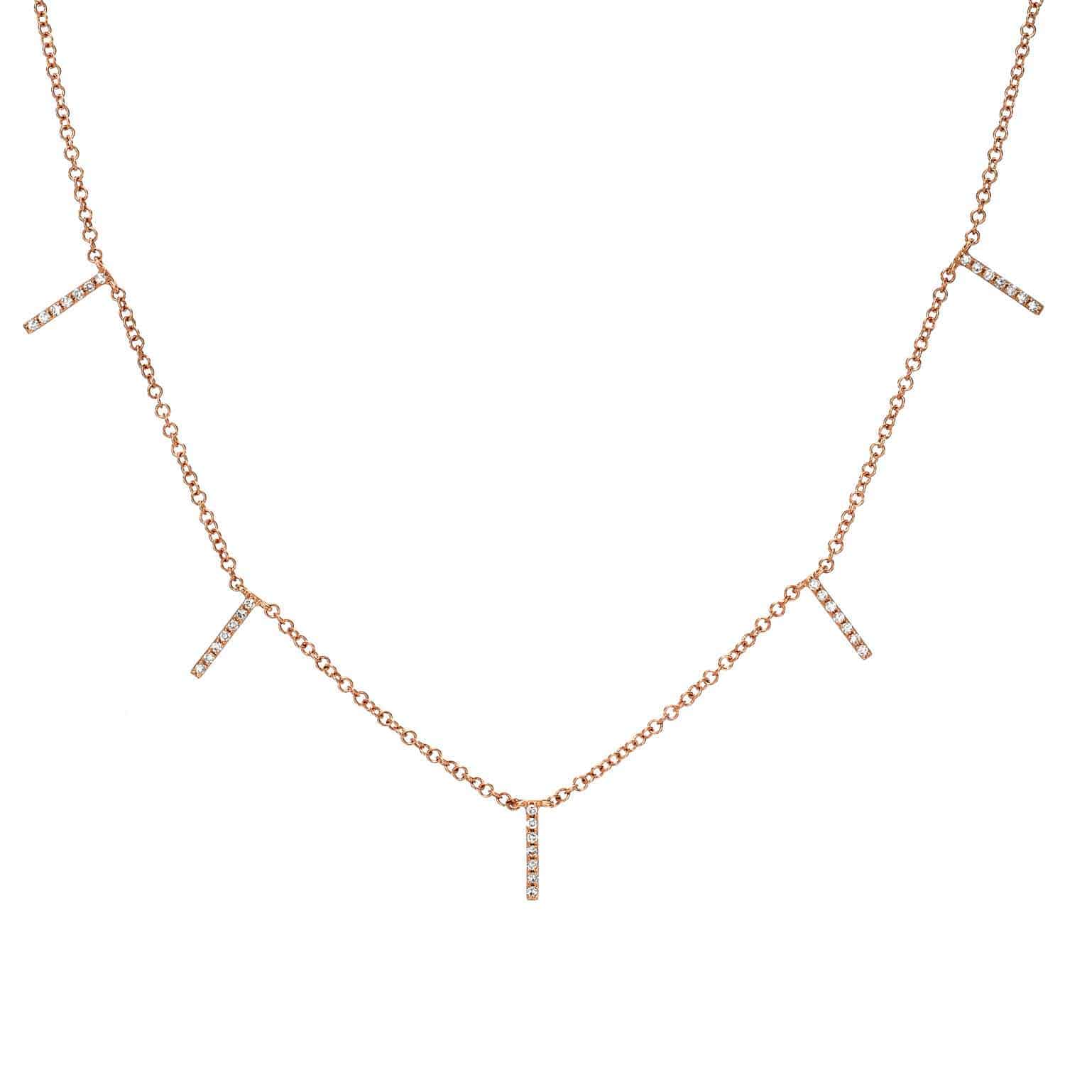 Showcasing the signature craftsmanship of Janet Heller Fine Jewelry, the Diamond Dangle Bar Necklace features a delicate gold chain adorned with five evenly spaced vertical bar pendants, each encrusted with sparkling diamonds. This timeless piece is perfect for both everyday wear and special occasions, embodying classic elegance and refined style.