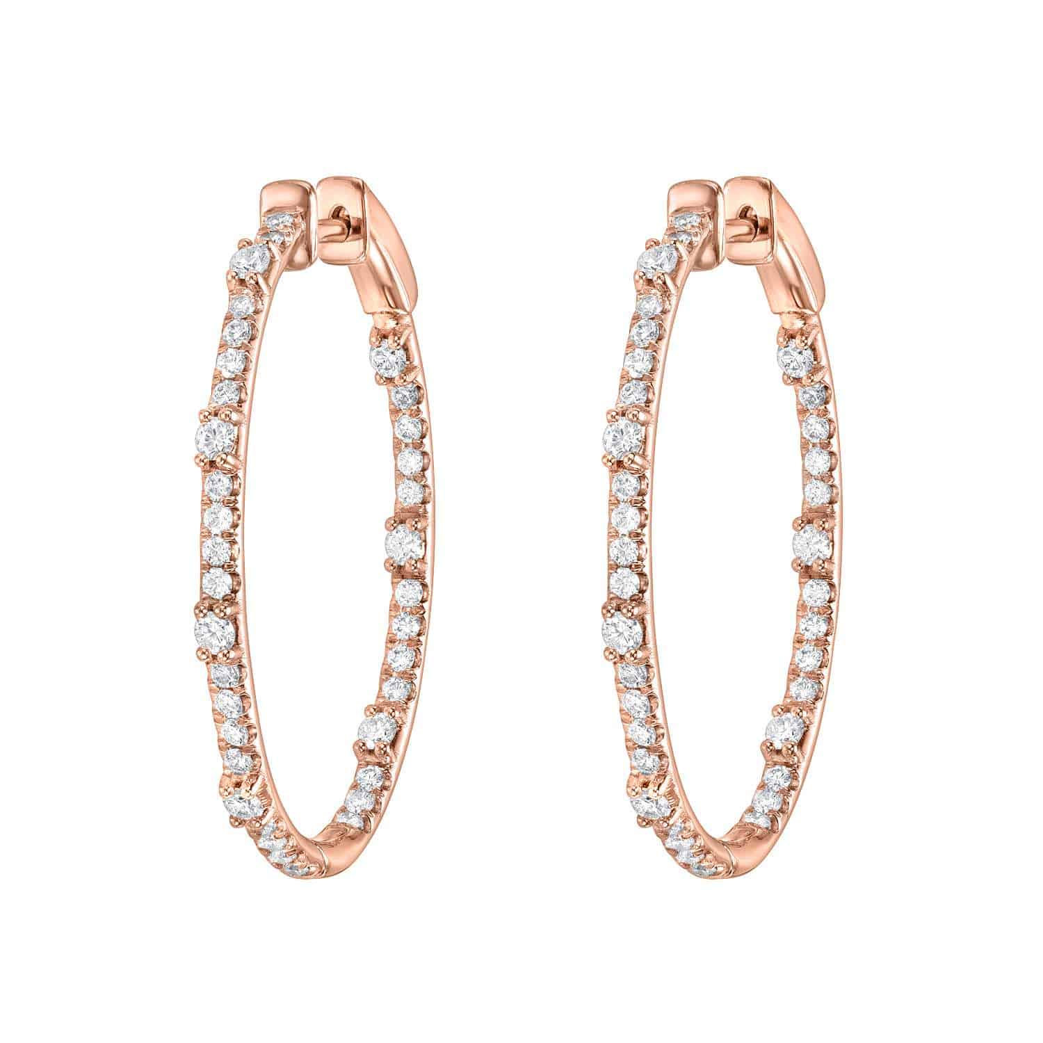 Presenting the Oval Chandler Hoops in rose gold, encrusted with round white diamonds and showcased against a pristine white background—a timeless creation from Janet Heller Fine Jewelry. For jewelry inquiries or to explore custom design options, please contact us.