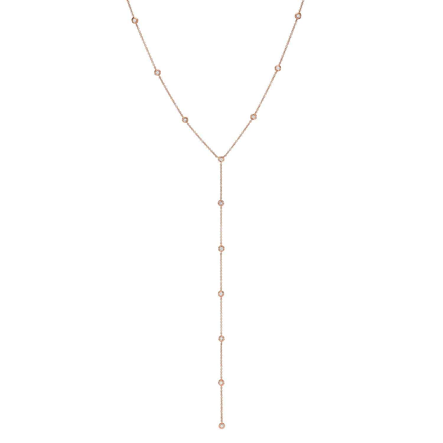 A delicate gold Y-shaped necklace from Janet Heller Fine Jewelry, the Diamond Sofia Lariat, features small round beads spaced evenly along the chain and a longer drop section hanging vertically.