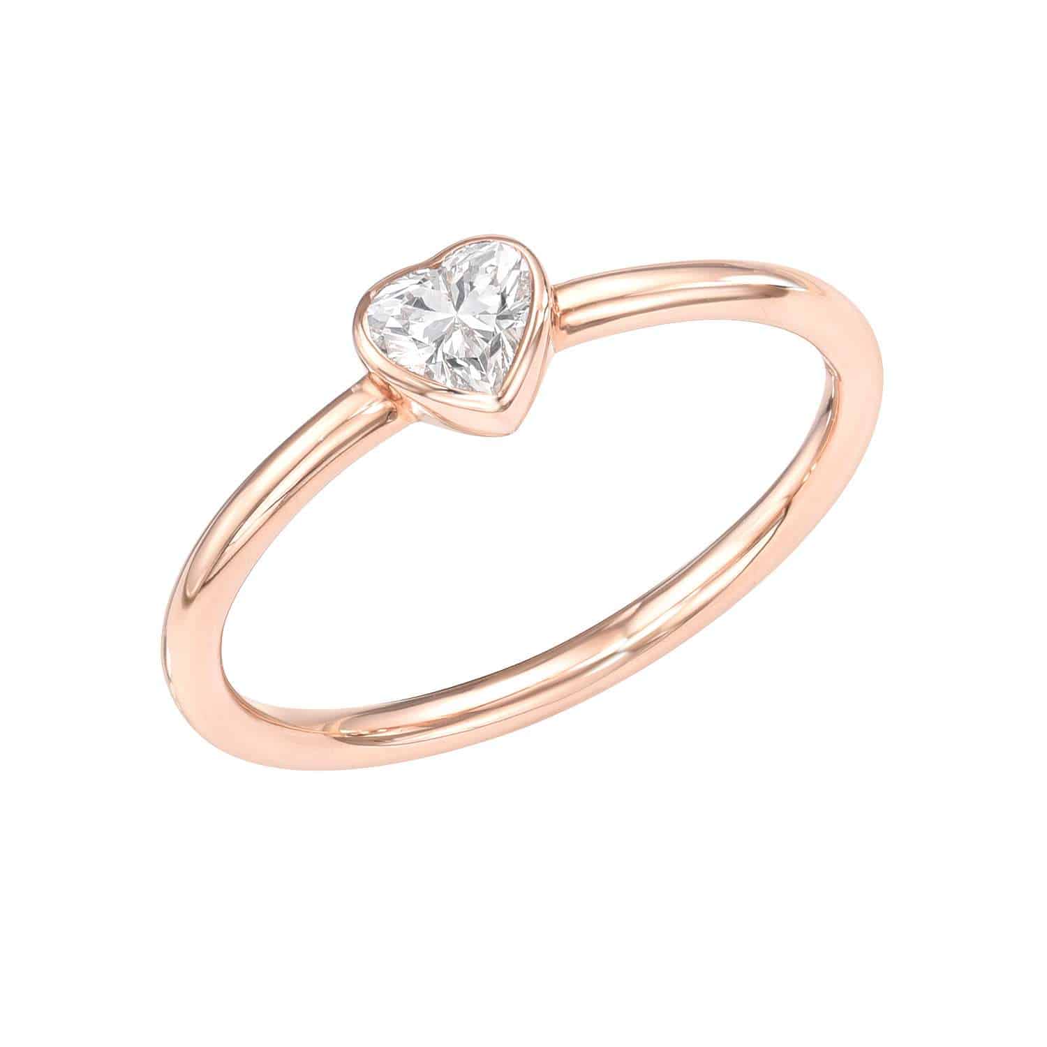 Preorder the Solitaire Diamond Heart Pinkie Ring, featuring a heart-shaped diamond elegantly set in a simple rose gold band that is thin and smooth, perfectly accentuating the exquisite centerpiece.