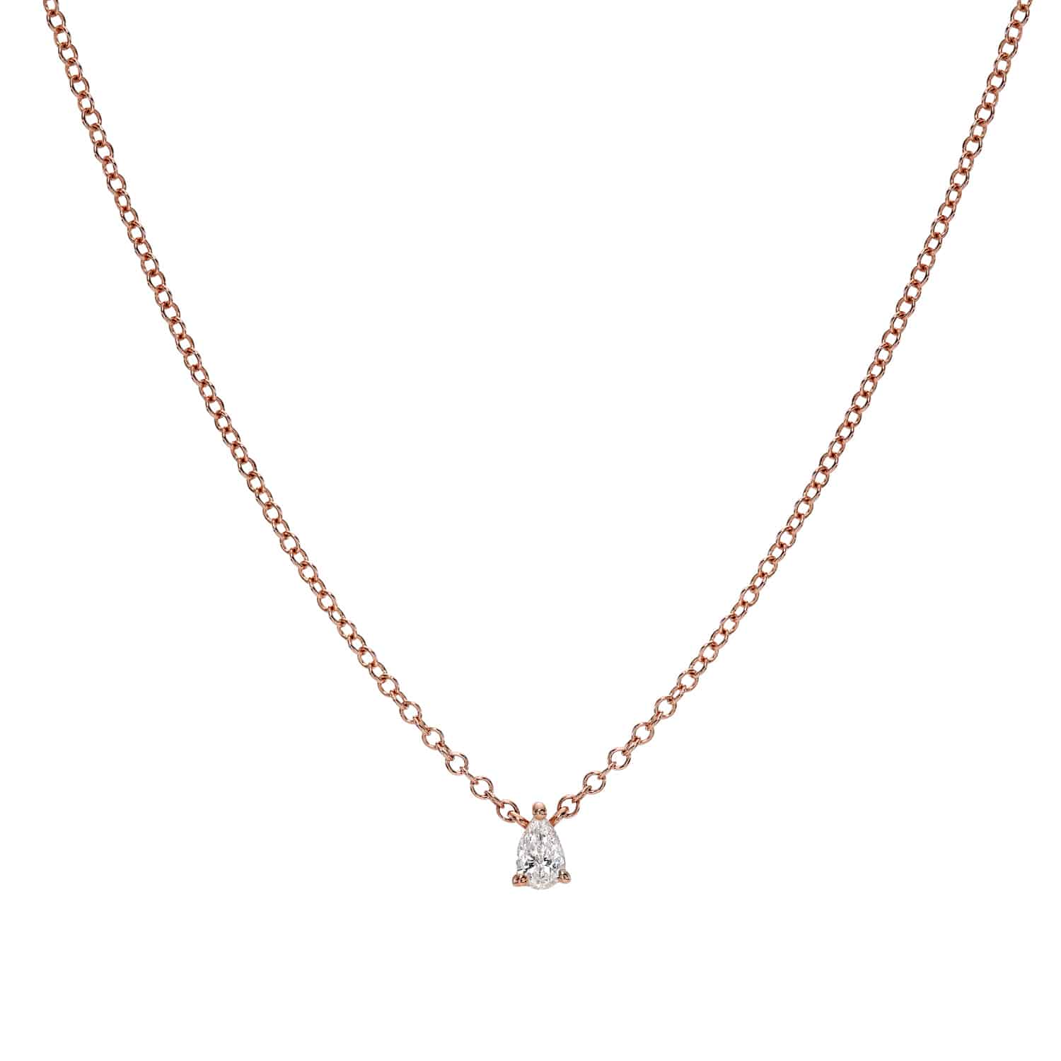 Solitaire Pear Cut Diamond Necklace in rose gold, featuring a small, pear-shaped diamond pendant expertly centered at the bottom. Showcasing Janet Heller’s mastery in fine jewelry design, the necklace is presented against a plain white background to highlight the custom piece’s understated elegance and simplicity.