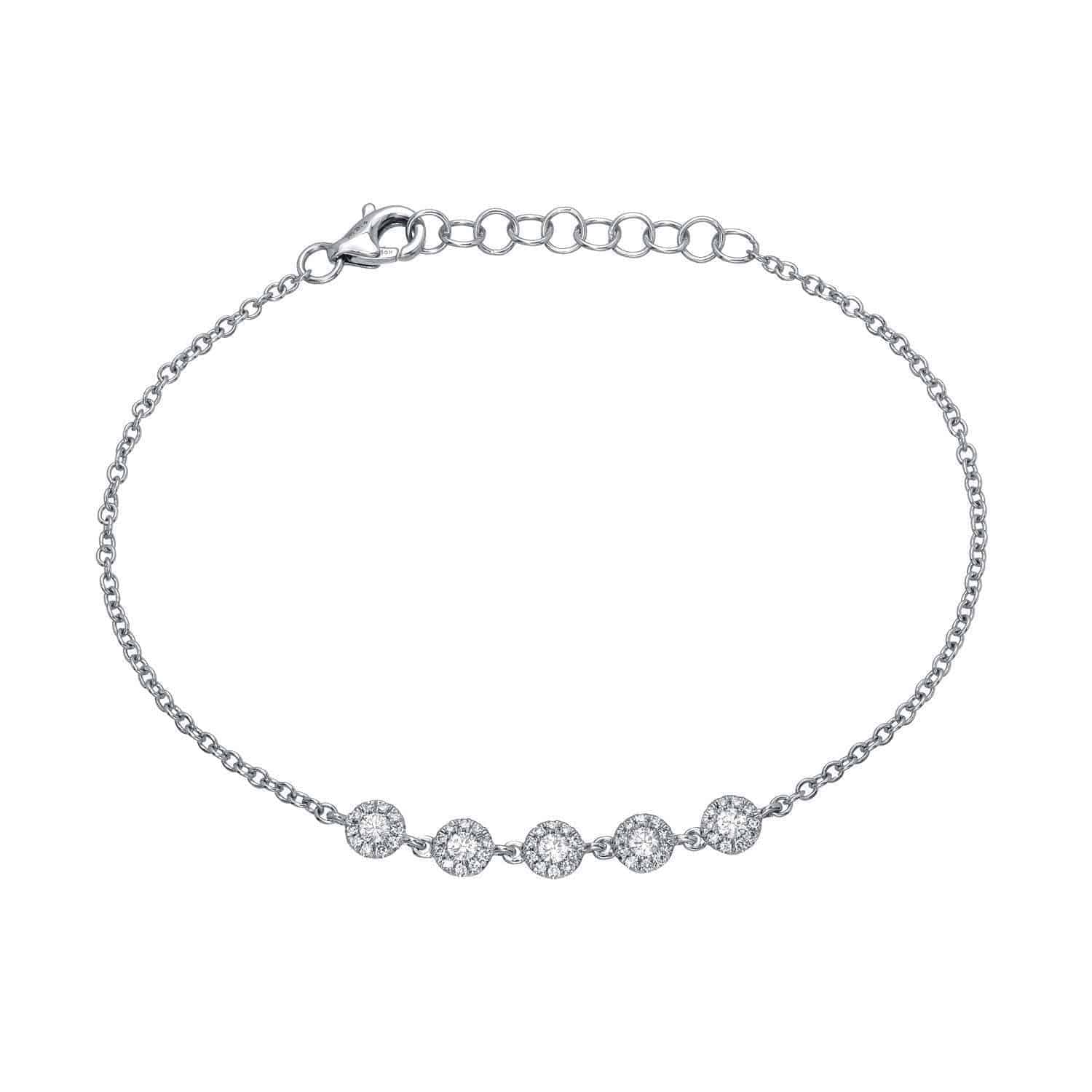 Certainly! Here’s a rewritten version of your sentence using the provided product data: The 5 Bezel Diamond Bracelet ($733.00) features five round bezel-set diamonds in a row on a delicate silver chain with an adjustable clasp—an elegant piece from Janet Heller Fine Jewelry. For jewelry inquiries, please contact us.