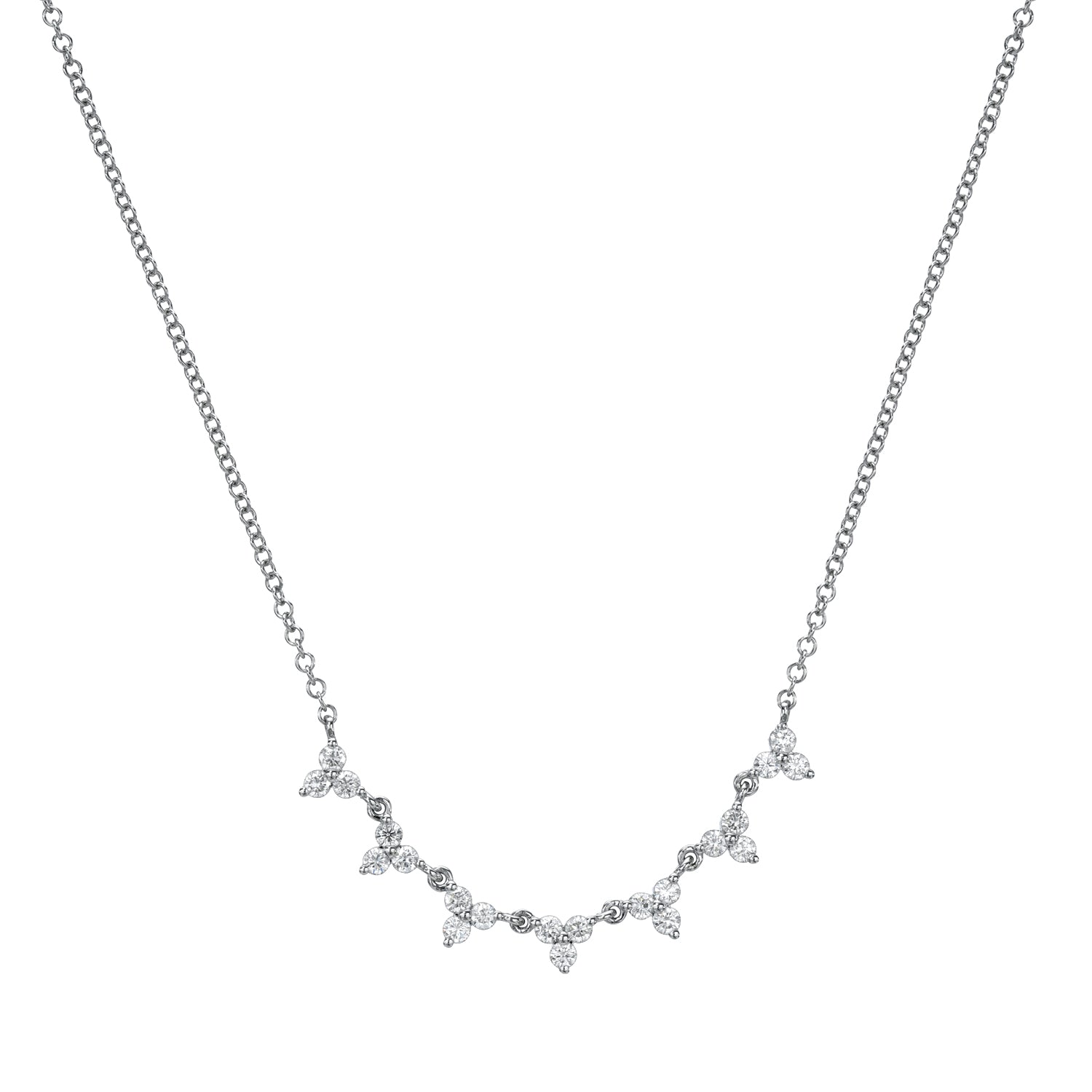 The Diamond Brea Necklace from Janet Heller Fine Jewelry is crafted in 14KT gold. The delicate chain features trios of diamond drops, each cluster linked by a solitary diamond. The necklace can be layered or worn on its own.
