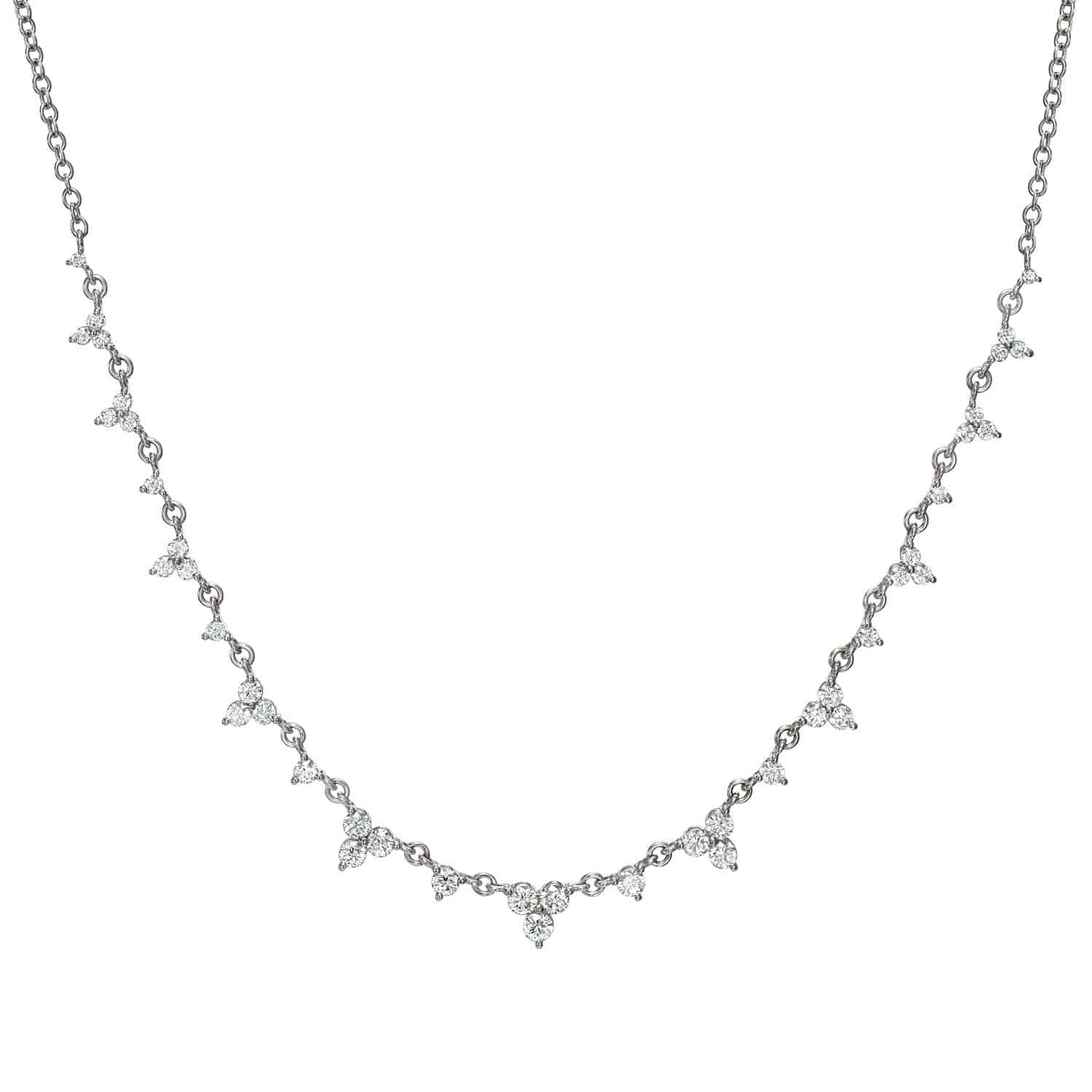 Explore the exquisite design of the Diamond Isabella Necklace by Janet Heller Fine Jewelry. With its delicate silver chain and evenly spaced diamond-shaped pendants, it offers subtle elegance and endless customization possibilities to match your unique style.