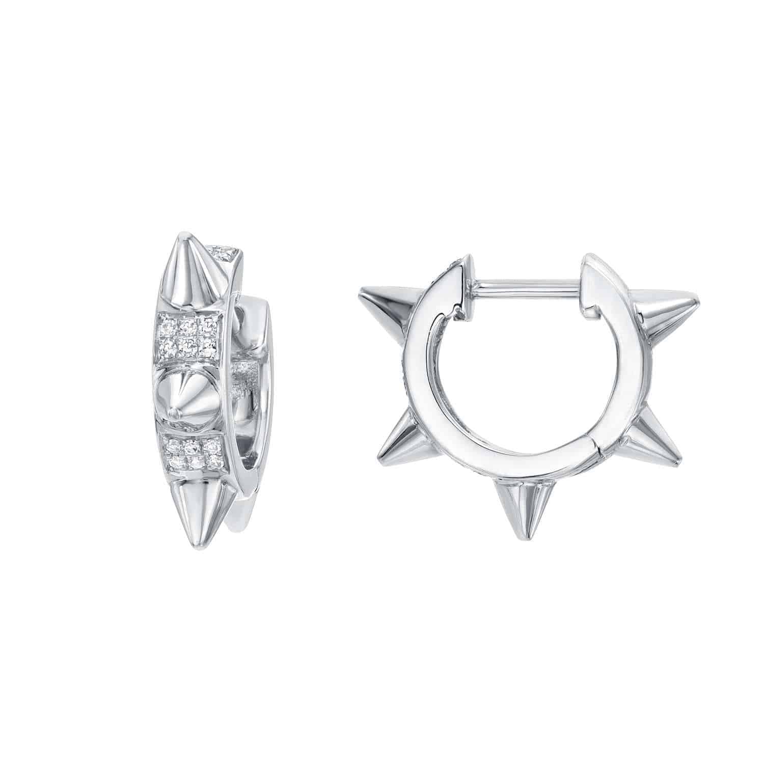 Introducing the Diamond Spike Huggies—striking silver hoop earrings adorned with three distinctive spike accents and a front row of sparkling diamonds. One earring is displayed from the front and the other from the side, showcasing their intricate design details. This bold pair embodies Janet Heller Fine Jewelry’s contemporary artistry, adding a modern edge to traditional fine jewelry craftsmanship. Price: $873.00.