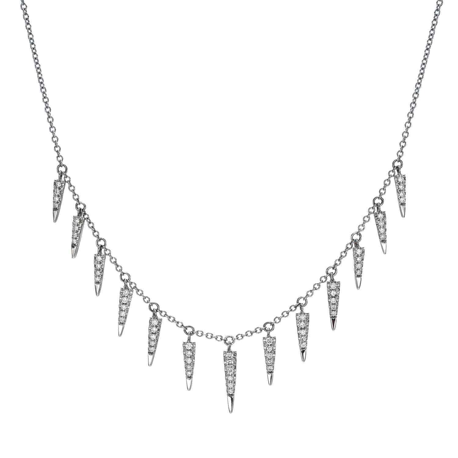 The Diamond Spike Necklace from Janet Heller Fine Jewelry is crafted in 14KT white gold.  The necklace features a delicate chain with evenly spaced, tapered spike diamond pendants. The necklace can be worn on its own or layered with other necklaces.
